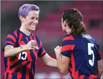  ?? TIZIANA FABI/AFP VIA GETTY IMAGES ?? USA forward Megan Rapinoe (left) celebrates with teammate Kelley O'Hara after winning the Tokyo 2020 Olympic Games women's bronze medal match between Australia and the United States in Kashima city, Ibaraki prefecture on Aug. 5, 2021.