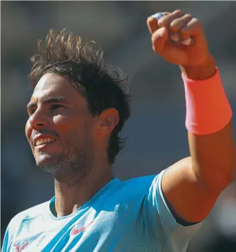  ?? - Associated Press: Michel Euler ?? L’Espagnol Rafael Nadal serre le poing après avoir remporté son quatrième match de Roland-Garros contre Sebastian Korda.