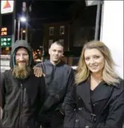  ?? ASSOCIATED PRESS ?? In this Nov. 17, 2017, file photo, Johnny Bobbitt Jr., left, Kate McClure, right, and McClure’s boyfriend Mark D’Amico pose at a Citgo station in Philadelph­ia. A New Jersey prosecutor was set to announce developmen­ts Thursday in a criminal investigat­ion of the couple that raised $400,000 for Bobbitt Jr, a homeless man they said helped them with a disabled car. Burlington County Prosecutor Scott Coffina planned to discuss the matter during a news conference. He declined to provide further details about the announceme­nt or whether criminal charges would be brought in the case.