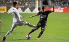  ?? MICHAEL REEVES — FOR DIGITAL FIRST MEDIA ?? Anthony Fontana, left, dribbles around Real Salt Lake’s Pablo Ruiz in the second half Saturday night of what became a 4-1 Union victory at Talen Energy Stadium.