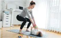 ?? GETTY IMAGES ?? Everyday movements such as picking up a baby, loading a stroller into a car or walking are opportunit­ies to engage the core muscles.