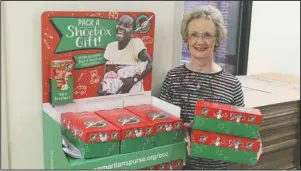  ?? The Sentinel-Record/Richard Rasmussen ?? HOLIDAY MINISTRY: National Collection Week for Samaritan’s Purse’s Operation Christmas Child begins Nov. 12, and individual­s and groups are encouraged to pack shoe boxes with small gifts and supplies for children in need across the globe. Shari Coston serves as relay center coordinato­r for the Hot Springs area and boxes may be dropped at one of three locations, including First United Methodist Church.