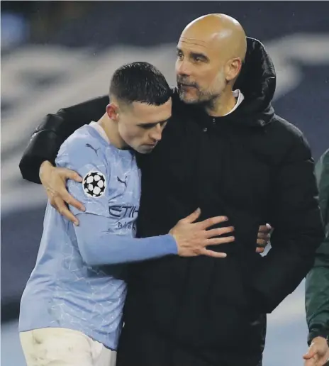  ?? Reuters ?? Pep Guardiola and Phil Foden during Manchester City’s victory over PSG in the Champions League on Tuesday