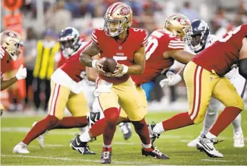  ?? SCOT TUCKER AP ?? Coach Mike Shanahan says the Niners have not given up on former first-round pick Trey Lance.