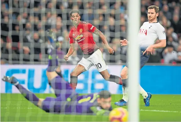  ?? Picture: Getty Images. ?? Marcus Rashford’s shot beats Spurs keeper Hugo Lloris to give Manchester United the lead at Wembley.