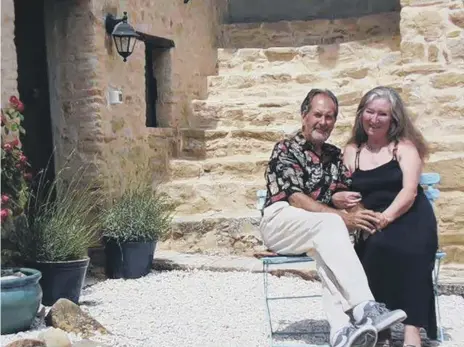  ??  ?? Greg and Sandra Perry on the steps of their Italian home.