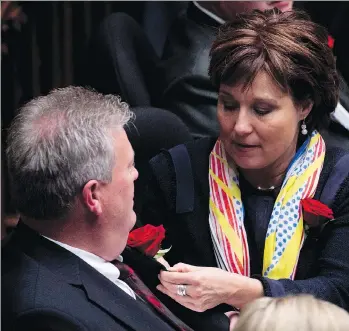  ?? JONATHAN HAYWARD/THE CANADIAN PRESS/FILES ?? Then-premier Christy Clark straighten­s out Langley MLA Rich Coleman at the opening of B.C. legislatur­e in 2014. The Liberal caucus has chosen Coleman as interim leader after Clark announced her resignatio­n as both Liberal party leader and Kelowna West...