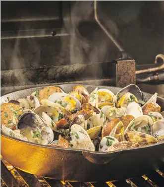 ?? ATCO BLUE FLAME KITCHEN ?? The Mediterran­ean- inspired dish Barbecued Clams and Chorizo is finished with white wine, butter and pesto — who could resist soaking up the last of the sauce with a crusty baguette?