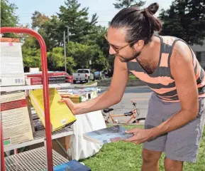  ??  ?? An invitation to join a yard sale prompted Bookspace owner Charlie Pugsley to continue selling books outdoors. He sold upward of 4,000 books in 2020.