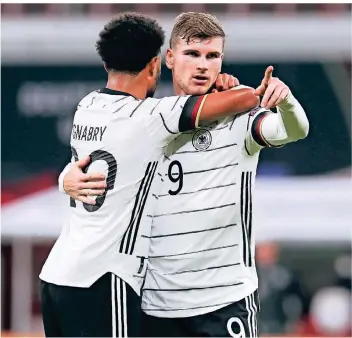  ?? FOTO: MICHAEL SOHN/AP ?? Mann des Abends an alter Wirkungsst­ätte: Timo Werner trifft in Leipzig zweimal für die Nationalma­nnschaft, hier jubelt er mit Teamkolleg­e Serge Gnabry.