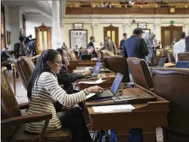  ?? DEBORAH CANNON / AMERICAN-STATESMAN ?? Rep. Dawnna Dukes takes her seat after arriving during the special session in the House chambers at the Capitol on Tuesday. Two of Duke’s three lawyers have filed a motion to withdraw from her case.