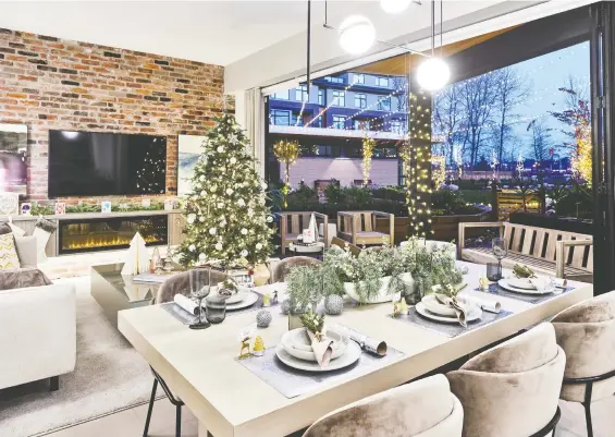  ?? PHOTOS: MARTIN KNOWLES ?? The decorated display suite at the Light House project by Aragon in New Westminste­r is a winter wonderland with lots of metallic accents and white decoration­s.