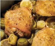  ?? (Photo by Rey Lopez for The Washington Post.) ?? Roasted Chicken Thighs with Leeks and Lemons.