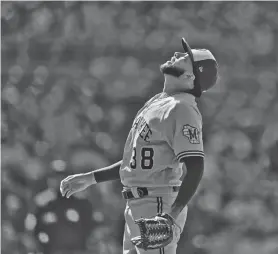  ?? ASSOCIATED PRESS ?? Brewers relief pitcher Devin Williams looks up as San Diego’s Trent Grisham pops out to end the game Wednesday in San Diego.