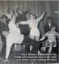  ??  ?? Mary Stewart in all white in the middle with husband Alex to her right and Jimmy Logan holding her hand