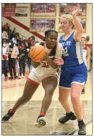  ?? (NWA Democrat-Gazette/Hank Layton) ?? Yonni Releford (left) of Fort Smith Northside drives as Emileigh Muse of Bryant defends during the fourth quarter Tuesday at Kaundart Fieldhouse in Fort Smith. The Lady Bears won 58-29. For more photos, see arkansason­line.com/15girlsbba­ll/