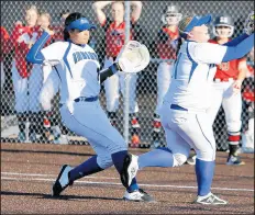  ?? SUZANNE TENNANT/POST-TRIBUNE ?? Towle, right, a finalist for Miss Softball in Indiana, fields a ball during a game against Marist.