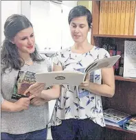  ?? SUBMITTED ?? Jinny Greaves, right, and Katie Duffy pose next to the P.E.I. Literacy Alliance’s new Volunteer Literacy Tutor Library.