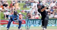  ?? AFP ?? New Zealand’s Martin Guptill plays a cover drive as Sri Lanka’s keeper Niroshan Dickwella keeping a close watch during the first ODI on Thursday at Bay Oval. —