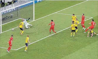  ?? THANASSIS STAVRAKIS
THE ASSOCIATED PRESS ?? England’s Harry Maguire (6), right, scores the opening goal Saturday against Sweden. England won, 2-0.