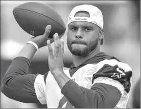  ?? Associated Press ?? Dak attack: Dallas Cowboys quarterbac­k Dak Prescott throws a pass during NFL football training camp in Oxnard, Calif. Prescott and the Dallas passing game have seen some rough patches early in training camp.