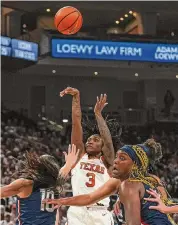  ?? Aaron E. Martinez/Associated Press ?? Texas guard Rori Harmon’s 27 points helped lead the Longhorns to a win over struggling Connecticu­t.