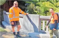  ??  ?? Left: Lead repair specialist Riki Archer shows one of the larger repairs to Department of Conservati­on works officer Charlotte Fletcher. Centre: The bridge remained open for visitors and work was scheduled to fit in with their routines. Right: An unusual view of the bridge.