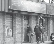  ??  ?? Windsor police attend the Compassion House on Tecumseh Road West Wednesday after a police raid at the site Tuesday night.