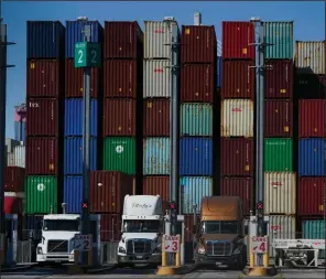  ?? (AP/Jae C. Hong) ?? Containers are stacked at the Port of Long Beach in Long Beach in Calif. in October. U.S. manufactur­ing growth slowed last month amid growing headaches from supply chain bottleneck­s.