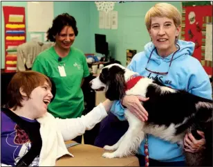  ?? Arkansas Democrat-Gazette/JOHN SYKES JR. ?? Debbie Strobel takes her therapy dog, Lexi, to United Cerebral Palsy’s North Little Rock Adult Center for a visit of cheer and encouragem­ent.