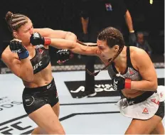  ?? Zuffa LLC ?? Liana Jojua of Georgia punches Miranda Maverick in their women’s flyweight bout on UFC Fight Island yesterday.