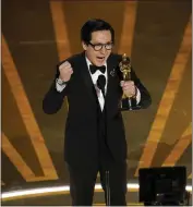  ?? CHRIS PIZZELLO — THE ASSOCIATED PRESS ?? Ke Huy Quan accepts the award for best performanc­e by an actor in a supporting role for “Everything Everywhere All at Once” at the Oscars on Sunday at the Dolby Theatre in Los Angeles.