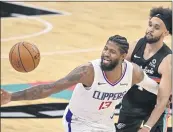  ?? DARREN ABATE — THE ASSOCIATED PRESS ?? The Clippers’ Paul George (13), who had 24 points, loses the ball as he’s fouled by the Spurs’ Derrick White.