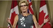  ?? RICHARD LAUTENS/TORONTO STAR ?? Premier Kathleen Wynne gave a pep talk at Queen’s Park on Thursday, but some thought she intended to resign, Martin Regg Cohn writes.