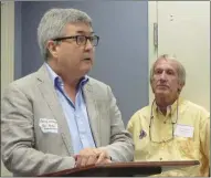  ?? Jeremy Stewart / Rome News-Tribune ?? Doug Wiley, vice president of Georgia Bicycle Adventures, talks about the growing area of bike tourism while Cave Spring Downtown Developmen­t Authority member Tom Lindsey listens Friday at the Cave Spring library during a meeting about a trail...