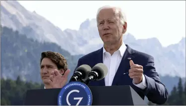  ?? POOL PHOTO ?? President Biden speaks next to Canadian Prime Minister Justin Trudeau during the first day of the G7 leaders’ summit at Bavaria’s Schloss Elmau castle, near Garmisch-partenkirc­hen, Germany, on Sunday.