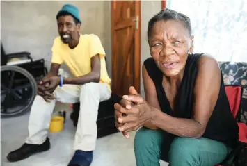  ?? African News Agency (ANA) ?? MIRTLE Virrooi and Dawid Koopman smile after receiving an RDP house at last. Mirtle, who is blind and uses a wheelchair, has been living in a one-room shack in a Sophiatown informal settlement in Blue Downs. | PHANDO JIKELO