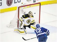  ??  ?? Toronto Maple Leafs forward Patrick Marleau scores his second goal of the night past Boston Bruins goalie Tuukka Rask in the Leafs’ 4-2 win Monday.