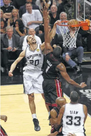  ?? Kin Man Hui / San Antonio Express-News ?? One of the most indelible moments of the Spurs’ 2014 NBA championsh­ip is Manu Ginobili dunking over Miami’s Chris Bosh. Ginobili also had a stress fracture in his leg.