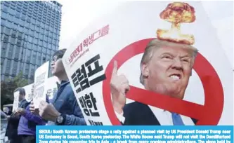  ??  ?? SEOUL: South Korean protesters stage a rally against a planned visit by US President Donald Trump near US Embassy in Seoul, South Korea yesterday. The White House said Trump will not visit the Demilitari­zed Zone during his upcoming trip to Asia - a...