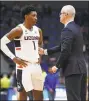  ?? Jessica Hill / Associated Press ?? UConn coach Dan Hurley talks with Christian Vital (1) during a recent game.