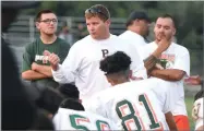  ?? RECORDER PHOTO BY CHIEKO HARA ?? Portervill­e High School’s head coach Michael Machado talks to his team after a scrimmage against Orosi High School at Frank Skadan Stadium in Lindsay.