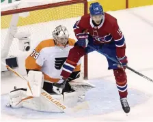  ?? AP ?? LOCKED IN: Screen attempts like those by Montreal’s Jesperi Kotkaniemi were no match for Philadelph­ia’s Carter Hart, who made 29 saves for his second straight shutout in the Flyers’ 2-0 win Tuesday.