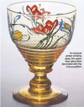  ??  ?? An unusual amber drinking glass, the upper clear glass bowl decorated with the crocus pattern