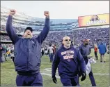  ?? David Banks / Associated Press ?? Chicago head coach Matt Nagy celebrates after the Bears defeated the Green Bay Packers 24-17 to clinch the team’s first division title since 2010.