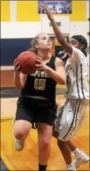  ?? GREGG SLABODA — TRENTONIAN PHOTO ?? Hopewell’s Meggy Wiley, left, drives to the basket against Nottingham.