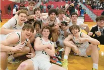  ?? RICK KINTZEL/THE MORNING CALL ?? The Allentown Central Catholic boys basketball team celebrates after beating Bethlehem Catholic last March 3 for the District 11 4A title.