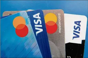  ?? John Raoux / Associated Press ?? After paying off credit card debt, it’s important to evaluate your relationsh­ip with plastic to determine whether a second chance is worthwhile.