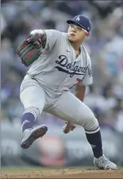  ?? Matthew Stockman Getty Images ?? JULIO URÍAS shut down the Rockies on four hits for seven innings, bouncing back from two shaky starts at Coors Field this year to improve to 10-6.