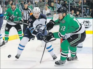  ?? CP PHOTO ?? Winnipeg Jets’ Jacob Trouba (8) and Dallas Stars’ Radek Faksa (12) compete for control of the puck in the first period of an NHL game, Thursday, Feb. 25, 2016, in Dallas. Mark Scheifele knew Trouba wasn’t completely happy with his situation when the...